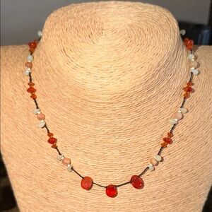 Vibrant Orange carnelian beads knotted on black silk thread necklace
